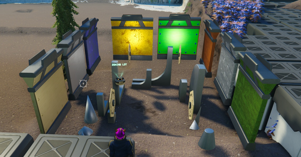 An assortment of building pieces and wall panels with colorful finishes around a zoning lot.