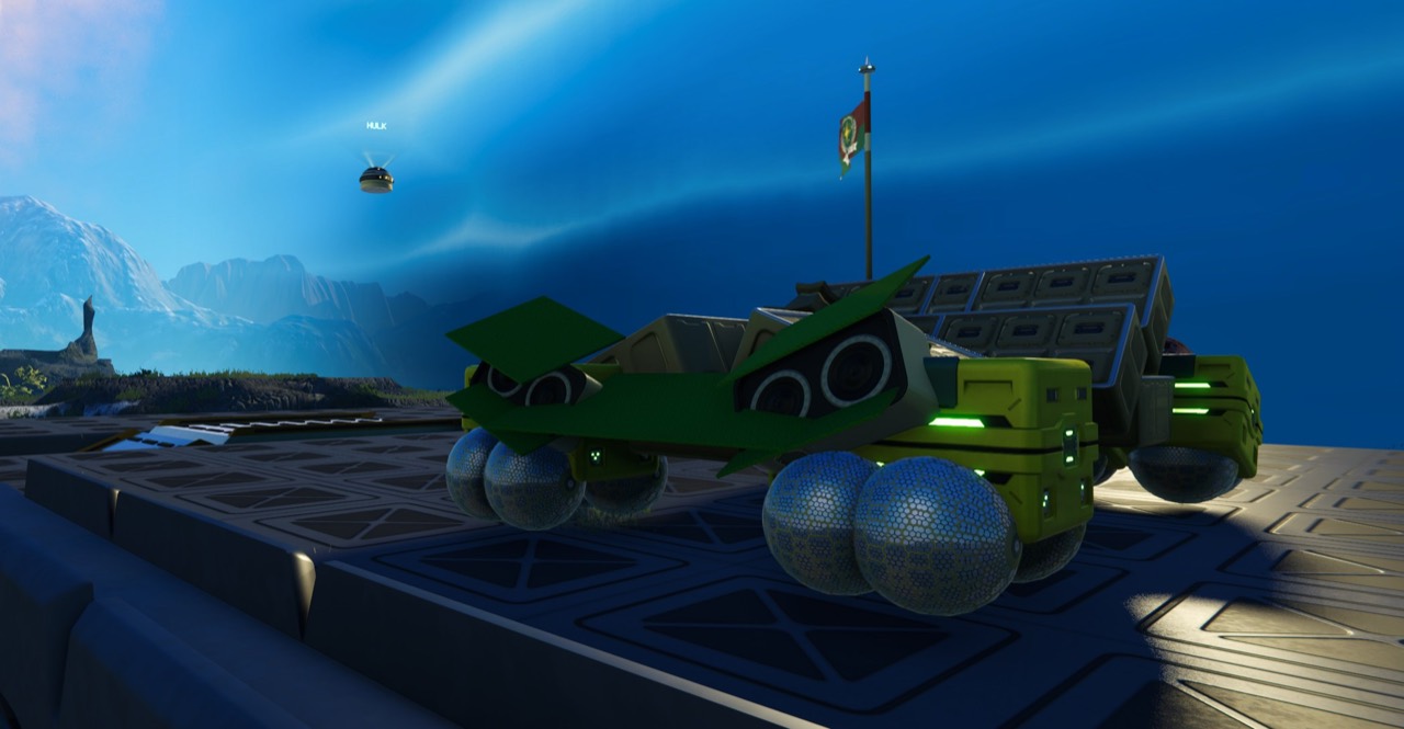 A bright green player-built vehicle parked beneath a GUNC flag in Stars Reach.
