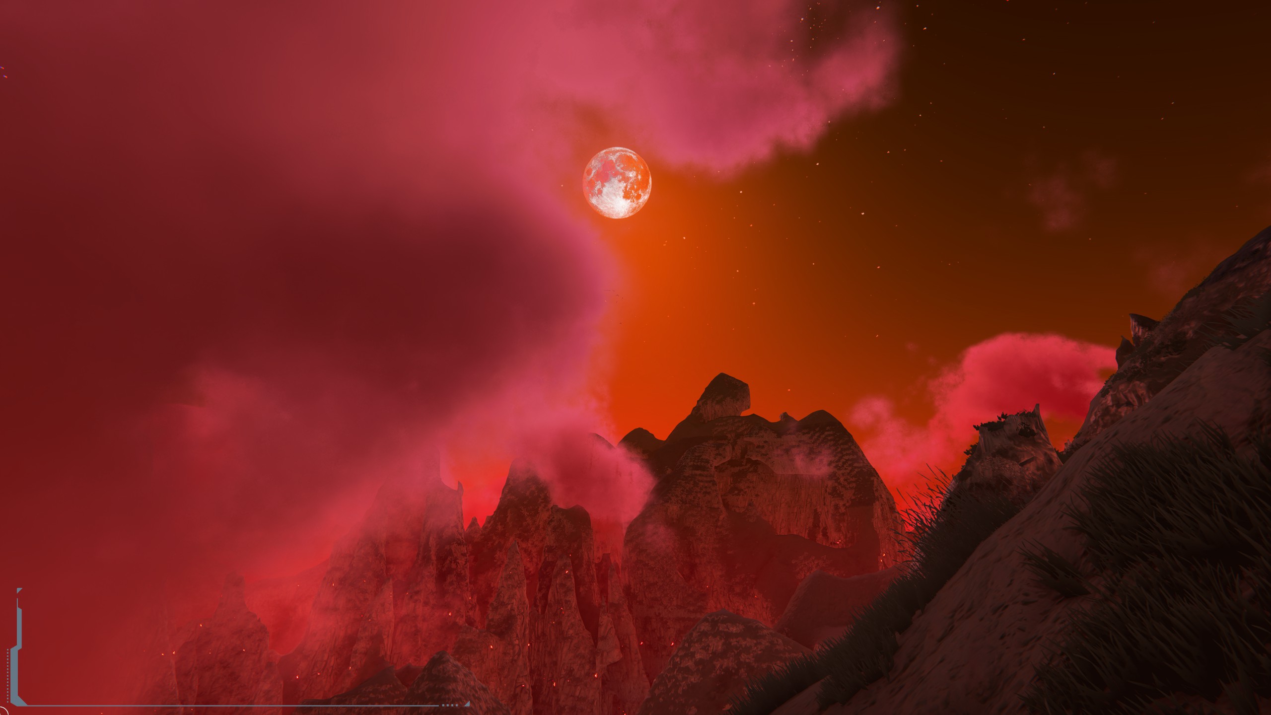 A bright moon above rocky peaks and pink clouds in a deep red sky.
